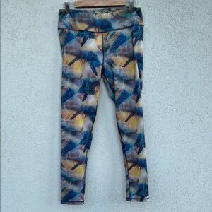 X by gottex leggings with an abstract print with moons and rocks. Inside pocket